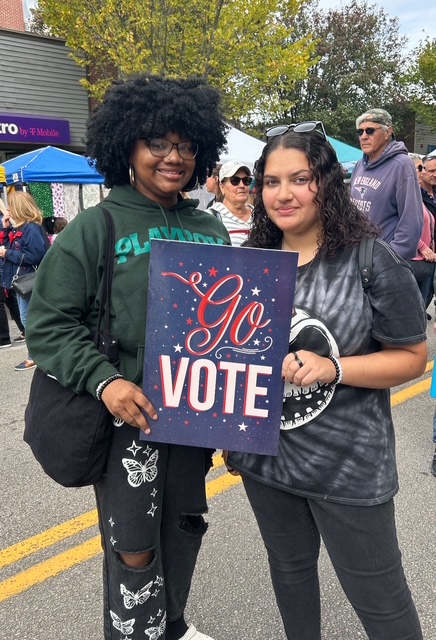 Volunteers with Go Vote signs